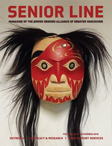 A mask with long black hair and red paint.